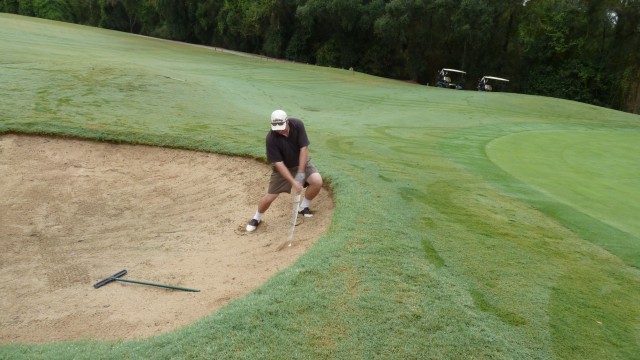 Me playing out of the 1st greenside bunker at Macquarie Links