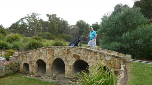 Playing partner Joe crossing a bridge at Monash Country Club