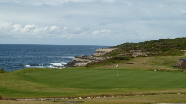 The 6th green at St Michaels Golf Club with sea in the background