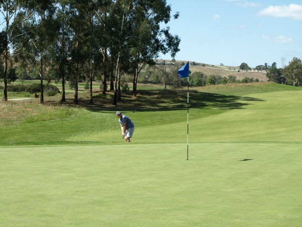 James chipping to the 14th green at Heritage Golf & Country Club St Johns Course