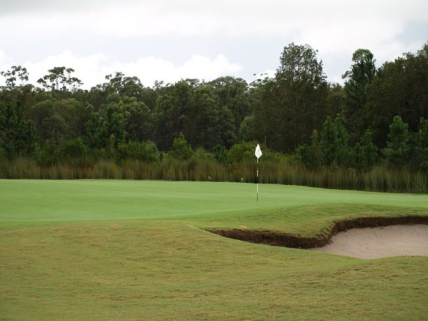 The 13th green at Pacific Dunes Golf Club