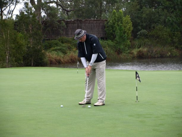 Me practice putting at Pacific Dunes Golf Club