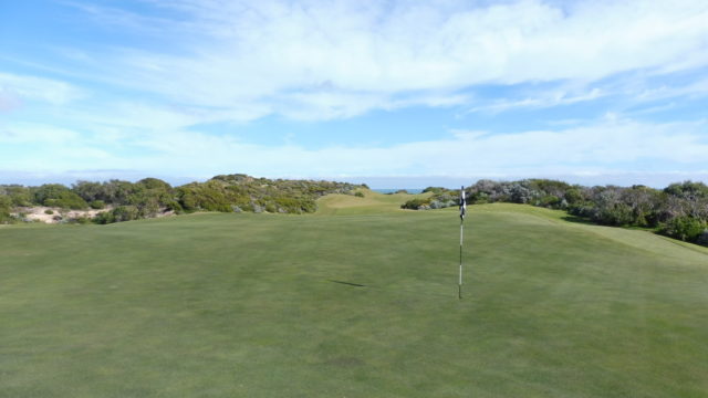 The 18th green at The Cut Golf Club