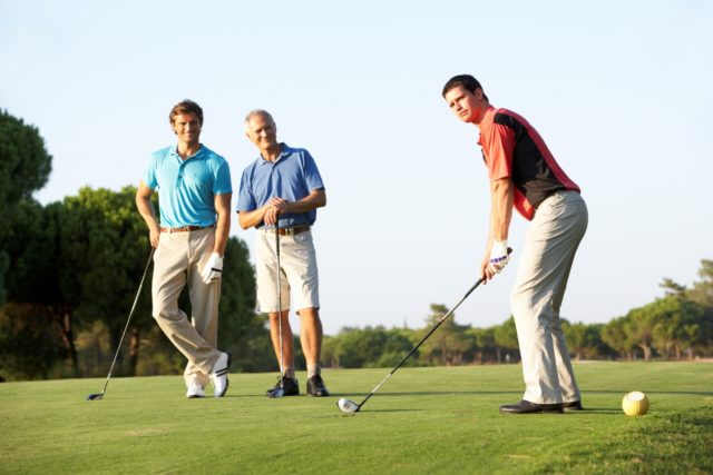 Golfer about to hit from the teeing ground