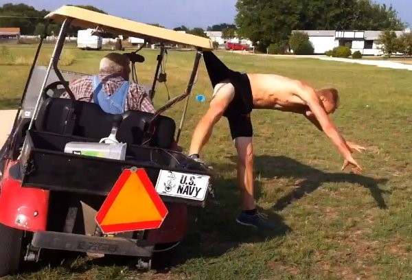 Guy with pants caught by golf cart falling off