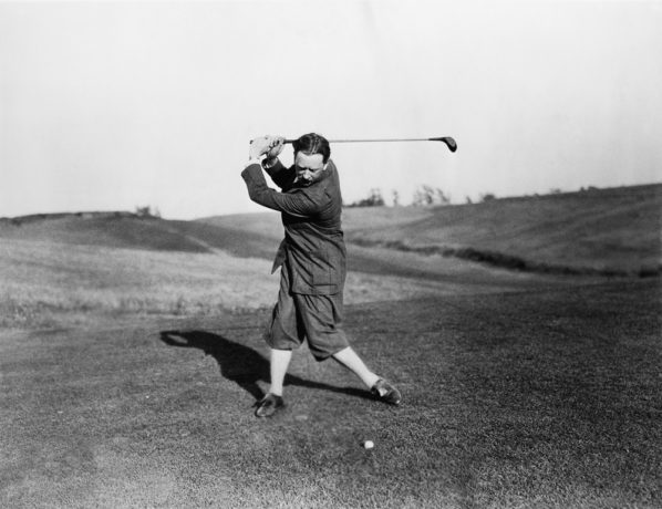 Vintage shot of man playing hickory golf club